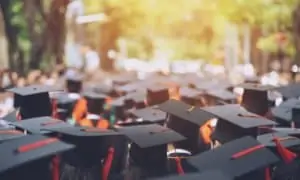 College graduates all wearing graduation cap