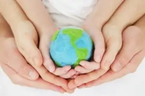 Image of Generations of People Holding the Earth