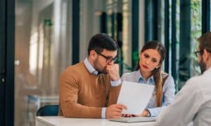 Business man and women looking over papers