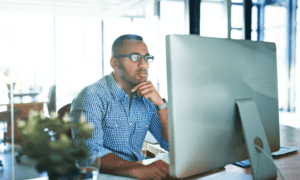 business man working hard looking at computer