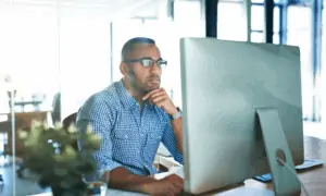 business man working hard looking at computer