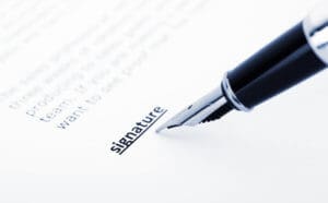 Image of pen signing name
