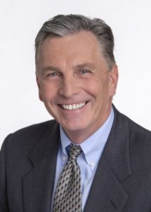 Professional headshot of Kirk Sanders