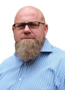 Professional headshot of Logan Ellis