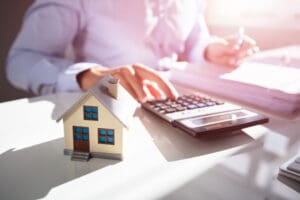 Businessperson Calculating Property Tax